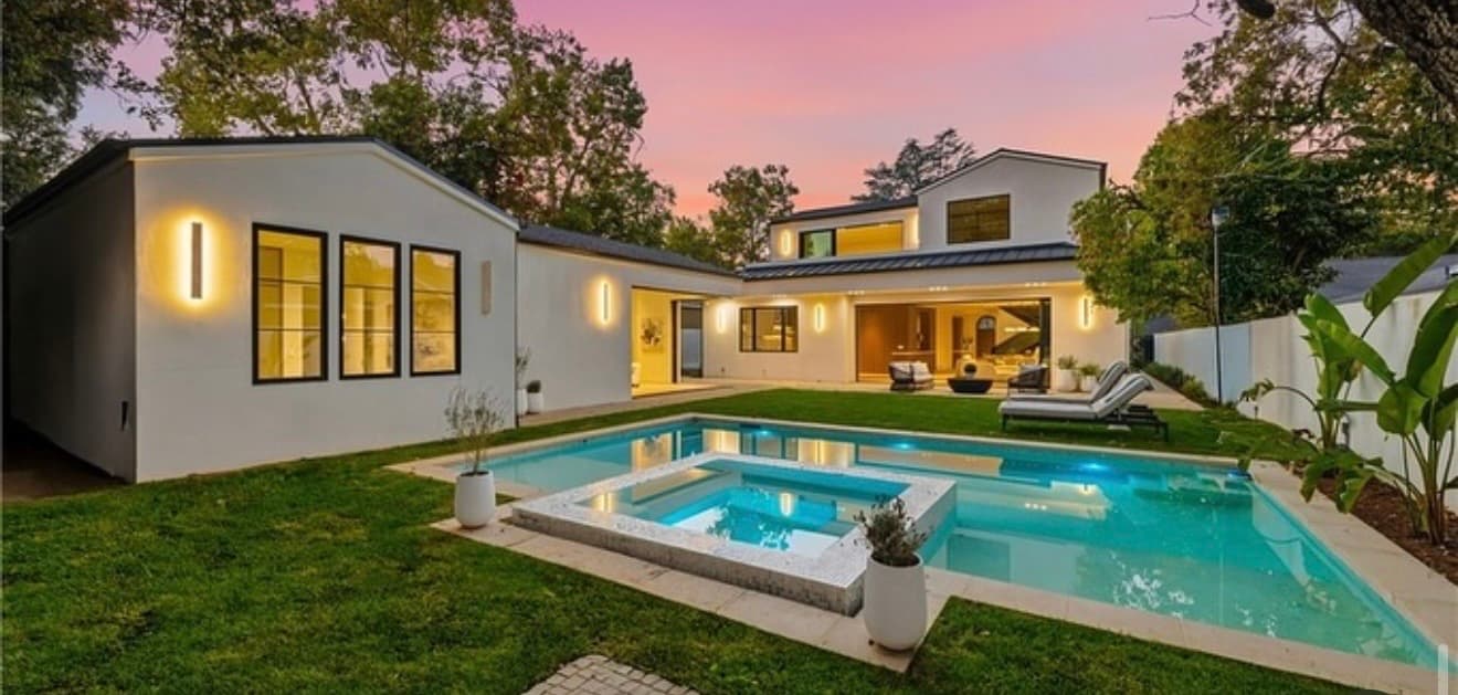 Twilight backyard with pool and spa
